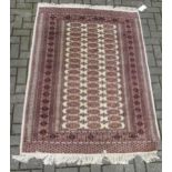 Sand colour ground rug with brown repeating medallions 187 x 130cm