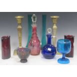 A collection of various coloured glass to include a pair of green glass slender vases, a Bristol