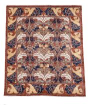 In the manner of C. F. A. Voysey, a large hand-knotted wool carpet, 20th century,