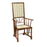 In the manner of E. W. Godwin, an Aesthetic period mahogany elbow chair,