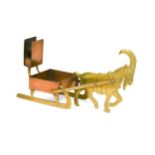 WMF, a copper and brass candle holder and match striker,