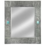 An Arts & Crafts pewter framed wall mirror,