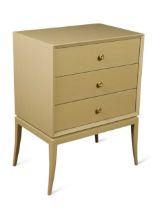 A grey lacquered chest of drawers of small proportions,