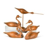 § Andy Pouch (Contemporary), four carved 'wormy chestnut' model swans,