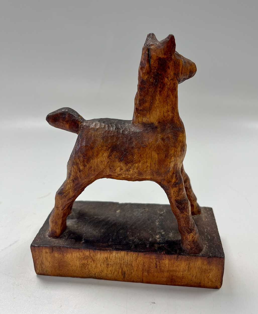 § Attributed to Arthur W. Simpson (1857-1922) of Kendal, a carved wood model of a foal, - Image 2 of 6