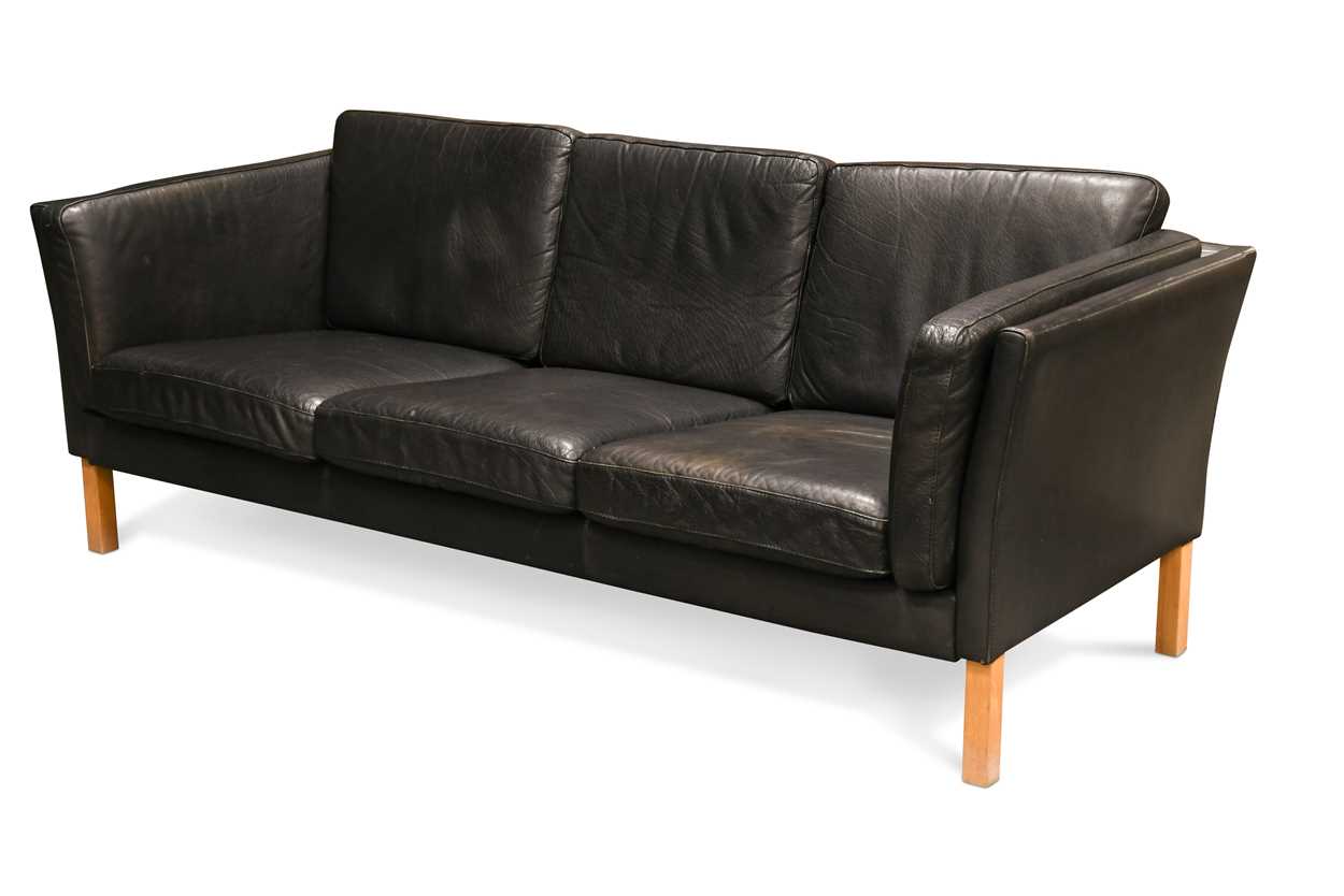 A Danish black leather three seat sofa,