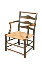 C. R. Ashbee for the Guild of Handicraft, a rush seated ash elbow chair, circa 1900,