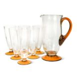 A clear and amber glass lemonade set, possibly Whitefriars,