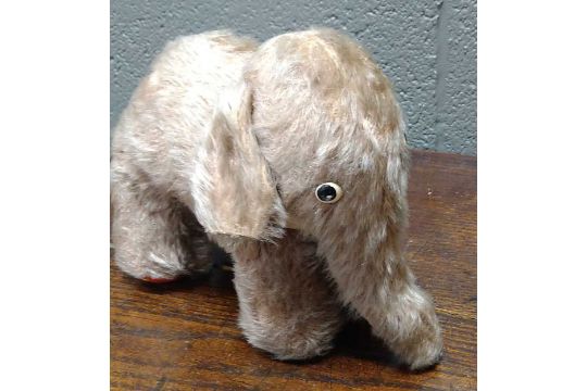 A collection of soft toys to include Merrythoughts mohair pink elephant, figure by Norah Wellings, - Image 1 of 21