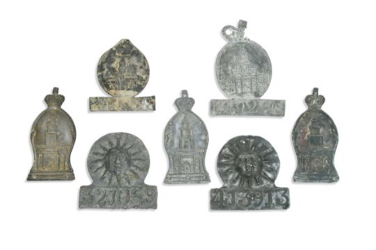 A collection of seven lead fire insurance plaques or marks, - Image 1 of 6