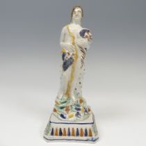 A 19thC prattware figure of Summer, modelled with cornucopia cluthed in arm, raised on plinth base