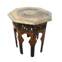 An antique Burmese inspired octagonal folding side Table, with red and gilt painted decoration, some