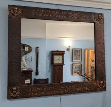 An Arts and Crafts Scottish school copper Mirror, hammered frame with stylised thistles to each