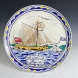 A Poole Pottery 'Sea Adventure' memorial Charger, designed by Arthur Bradbury and painted by Karen