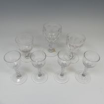 A set of four antique Wine Glasses, with round funnel bowl on faceted stem, H 14.5cm, together