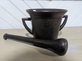 A large antique cast iron Pestle & Mortar, W 29 cm x H 20.5 cm x D 24 cm.