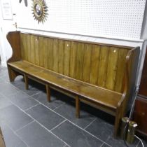 An early 20th century Pew, with match-boarded back, W 224 cm x H 104 cm x D 40 cm.