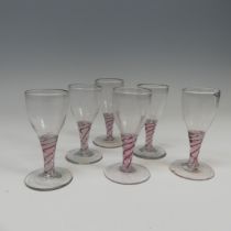 A matched set of six good quality antique Wine Glasses, probably 18th century, the ovoil bowl on red