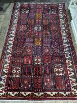 Tribal rugs; a good Persian Hamadan red-ground carpet, wool pile on cotton base, 266cm x 173cm, good