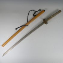 A decorative Japanese inspired Katana, with resin faux ivory handle and light wooden saya, length