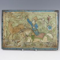 A 19thC Persian pottery Tile, depicting figure on horseback, 24cm x 34.5cm.