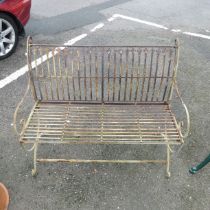 A Regency style painted metal garden Bench, with wirework back and scroll arms and supports, W 103