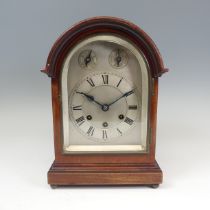 A mahogany chiming and striking Mantle Clock, the silvered dial with Roman numerals, chime,