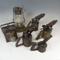 A vintage Sherwoods storm Lantern, together with four vintage brass blow torches, including ;