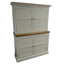 A painted reconstituted pine housekeepers Cupboard, W 134 cm x H 183 cm x D 43 cm, together with a