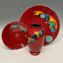 A large Poole Pottery Volcano Charger, D 41 cm, together with another smaller D 26 cm and a Vase(3)