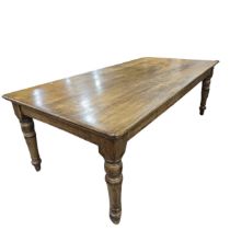 An early 20th century oak Farmhouse Kitchen Table, five plank rectangular moulded top raised on four