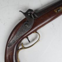 A percussion cap target Pistol, 7 1/2 inch barrel, fitted with brass furniture and shaped stock,