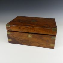A Victorian mahogany brass bound Writing Slope, hinged lid enclosing fitted interior housing twin