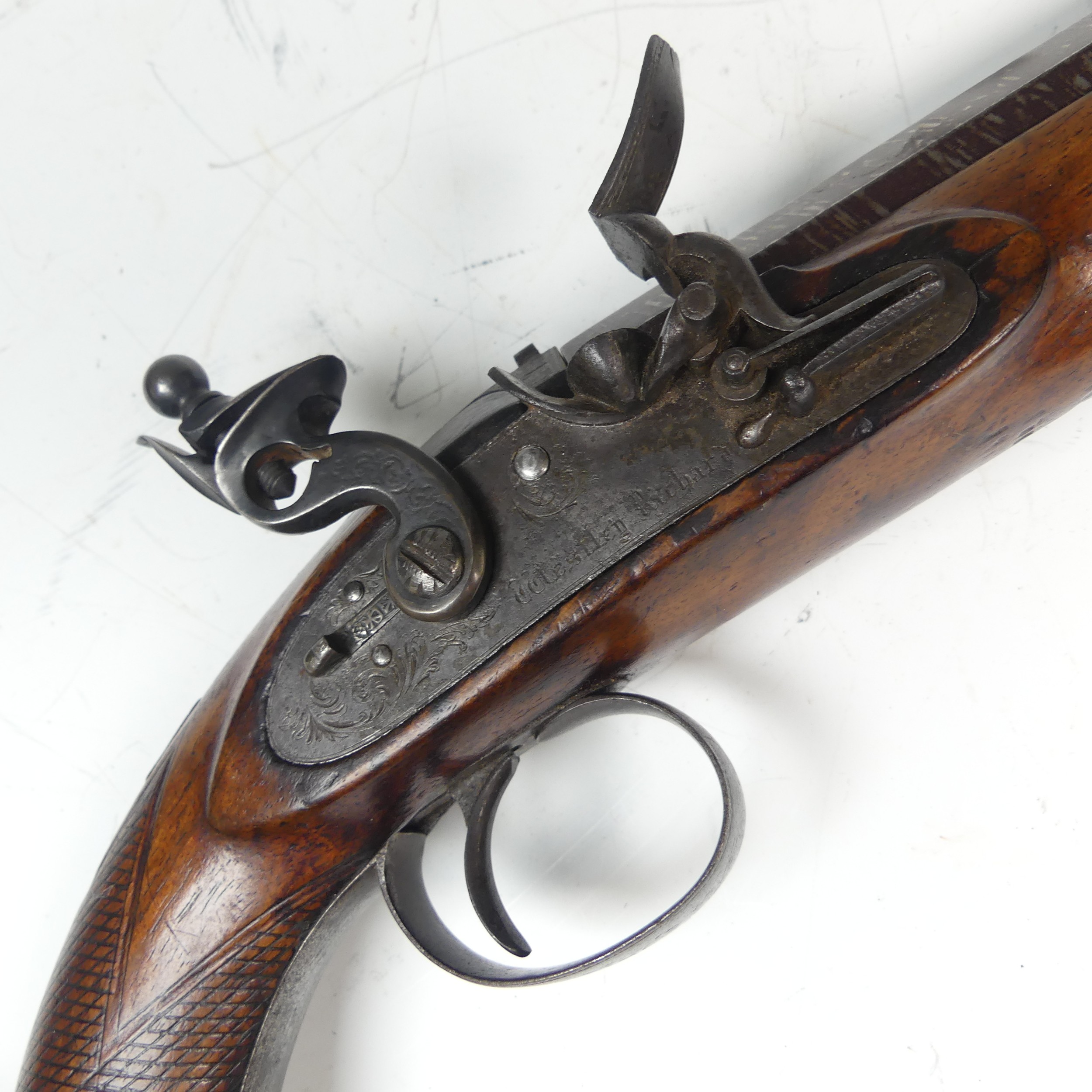 A Westley Richards flintlock Pistol, 8'' octagonal barrel inscribed "Westley Richards", with