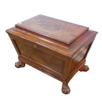 A Georgian mahogany sarcophagus Wine Cooler, moulded hinged top concealing lined interior, raised on