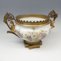 A Sevres porcelain Chateau de Fontainebleau ormolu mounted Centrepiece, the twin handled Bowl with
