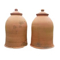 A pair of weathered terracotta Rhubarb Forcers with covers, one with damaged cover and base, H 60