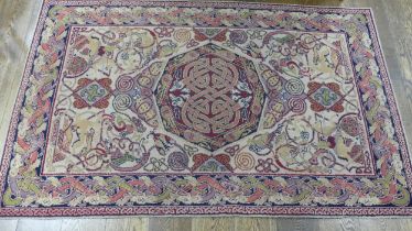 A decorative Arts & Crafts style 'Manx Revival', machine-made rug, 200cm x 122cm.