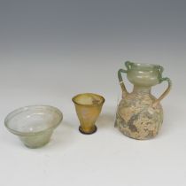 A Roman green glass twin-handled Flask, of bulbous form, H 14.5cm, together with a Roman glass