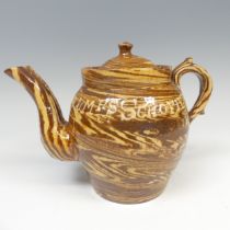 A late 19thC slipware marriage Teapot, with double spout and cover, chips to rim, inscribed for '