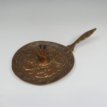 John Pearson, an Arts and Crafts copper Chamber stick, repoussé decorated with stylised foliage on a