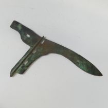 A Chinese bronze dagger axe (ge or ko), double edged blade with rectangular tang flange pierced with