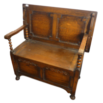 A carved oak monks Bench, with rising and falling lid over box base with carved detail, W 91.5 cm