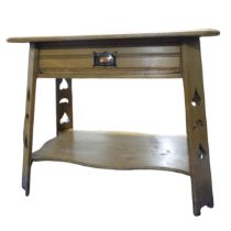 An Arts and Crafts side blond oak side Table, moulded square top above chamfered central drawer