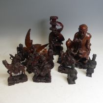 A Chinese root carving of an Elder, modelled with creature at his feet, raised on stand, H, together