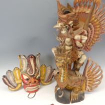 A large Vintage carved polychrome figure of Garuda, H 76.5 cm, together with a painted carved Tribal