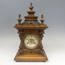 A late 19th century continental walnut Mantel Clock, movement marked with crossed arrows and