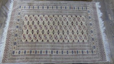 Tribal rugs; an old hand-knotted Bokhara rug, fine wool pile on a cotton base, 196cm x 130cm, good