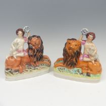 A matched pair of 19thC Staffordshire pottery figural Bookends, modelled as a recumbent lion with