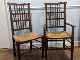 A set of eight Lancashire style antique fruitwood spindle back dining Chairs, shaped backs above